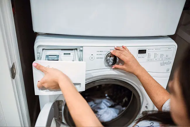 Woman preparing to wash clothings